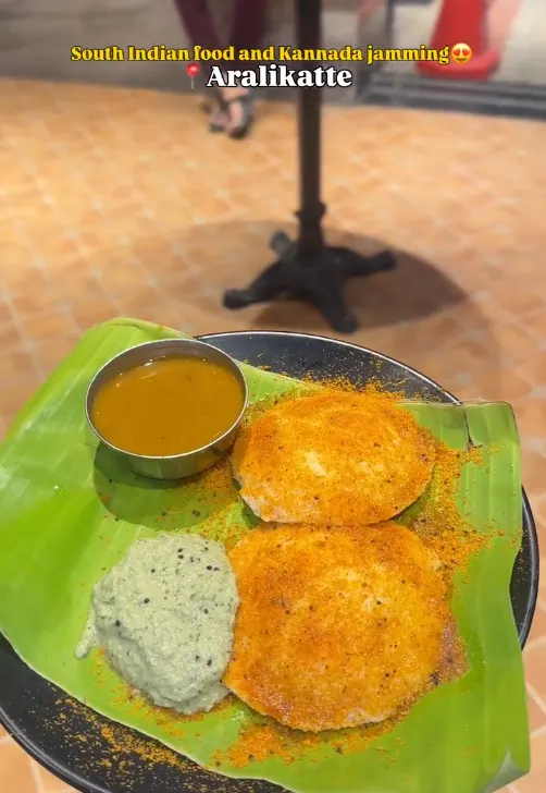 Spiced idlis with sambar and coconut chutney on a banana leaf